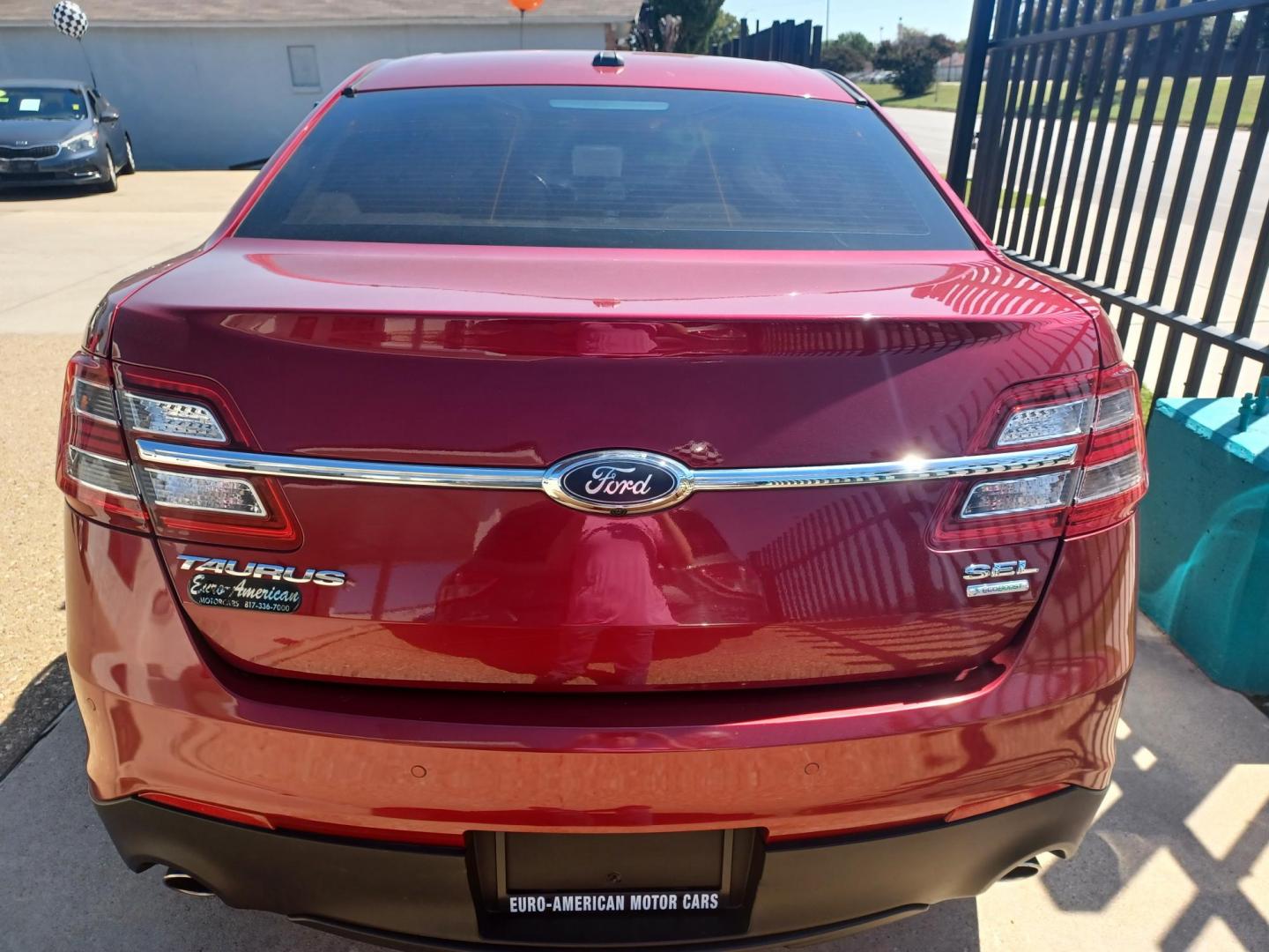 2016 RED /TAN, LEATHER Ford Taurus SEL FWD (1FAHP2E94GG) with an 2.0L L4 DOHC 16V engine, 6A transmission, located at 2001 E. Lancaster, Ft. Worth, 76103, (817) 336-7000, 32.746181, -97.301018 - Photo#6